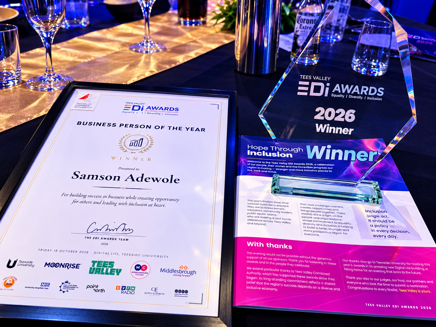 Business Person of the Year certificate presented to Samson Adewole beside the Tees Valley EDI Awards 2026 winner trophy